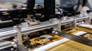 Industrial machinery providing professional print lamination services for high-quality full-color posters.