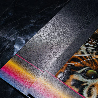 Close-up of professional textured lamination with a leather-like grain on a printed book cover featuring a tiger illustration.