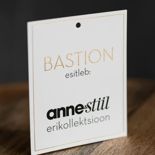 A custom size gold foil hang tag. Featuring a minimalist white design and thin gold border.