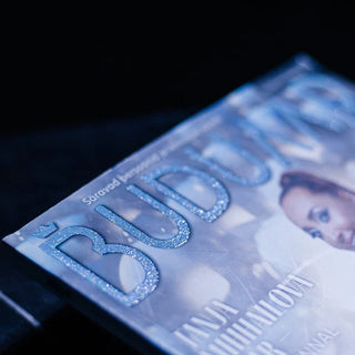 Magazine cover featuring a light blue glitter screen print on the logo.