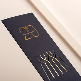 Minimalist black invitations featuring the gold foil logo and elegant vertical gold foil and spot uv line accents.