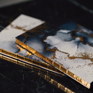 Premium notebook wholesale suppliers featuring marble print journals with elegant gold gilded edges.