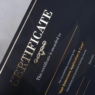 Professional certificate featuring raised foil printing in gold for a hair extension training course.