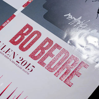 Magazine cover showcasing a bold red glitter screen print on the main title text for a holiday edition.