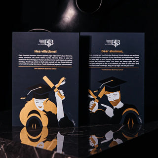 Gold and white screen printing on black paper for Estonian Business School graduation cards.