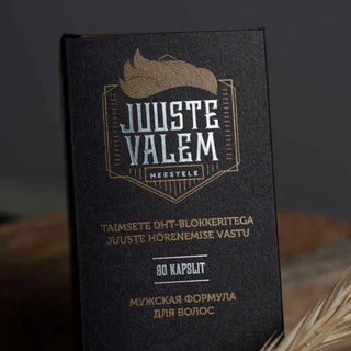 Product packaging featuring silver foil printing on the main logo and gold accents.